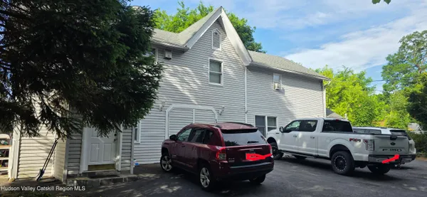a view of a car in front of house