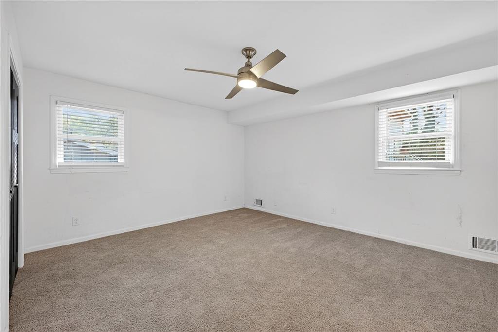 1200 Silver Hill Road Stone Mountain, GA 30087 - Photo 12 of 26 a view of an empty room with a window