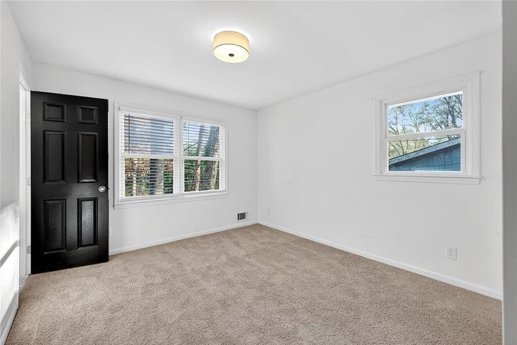 1200 Silver Hill Road Stone Mountain, GA 30087 - Photo 18 of 26 an empty room with windows
