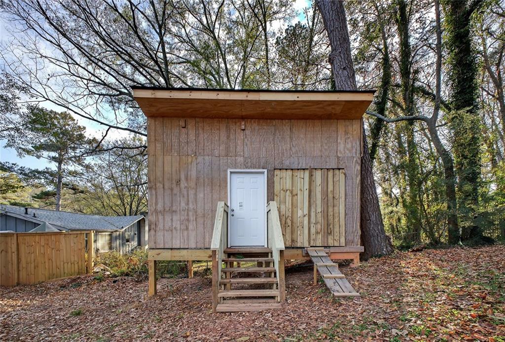 1200 Silver Hill Road Stone Mountain, GA 30087 - Photo 22 of 26 a backyard of a house with table and chairs