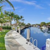 a view of a backyard with sitting area
