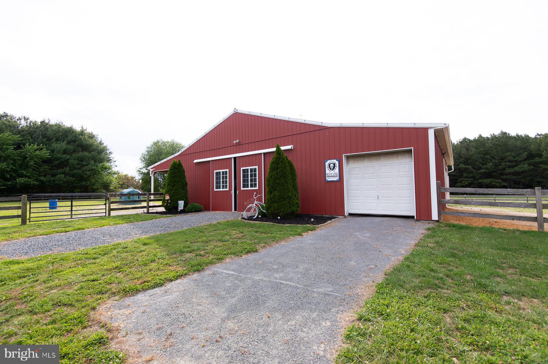 12136 Holly Road Ridgely, MD 21660 - Photo 83 of 136 a front view of a house with a yard and garage