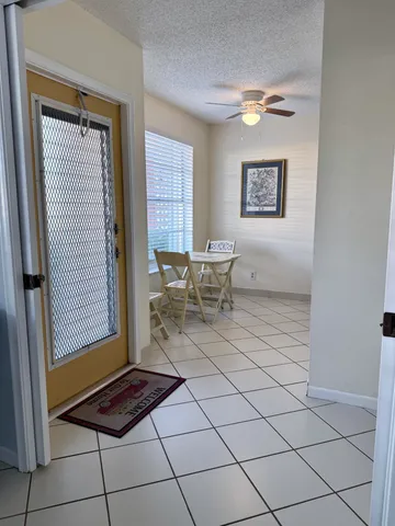 a living room with a furniture and a window