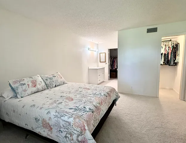 a white toilet sitting next to a shower curtain