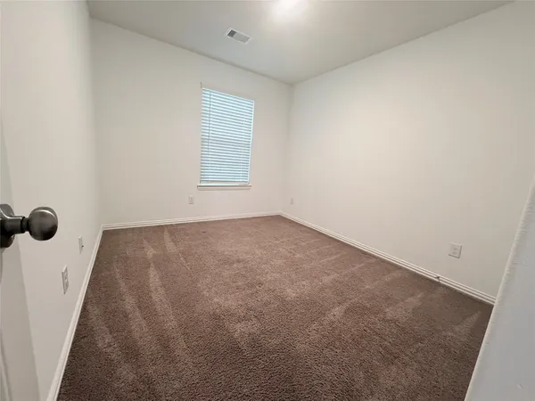 an empty room with a workbench