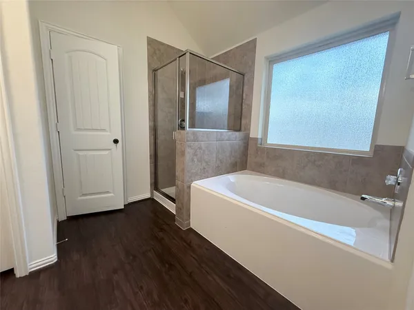 a white bath tub sitting in a bathroom