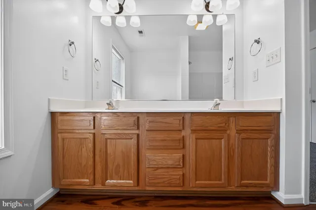 an entryway with wooden cabinet