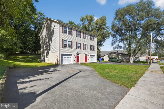 a view of a building with a yard