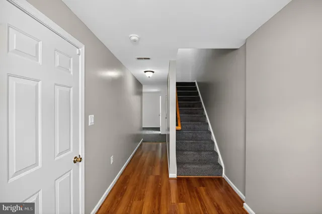 a view of entryway with wooden floor