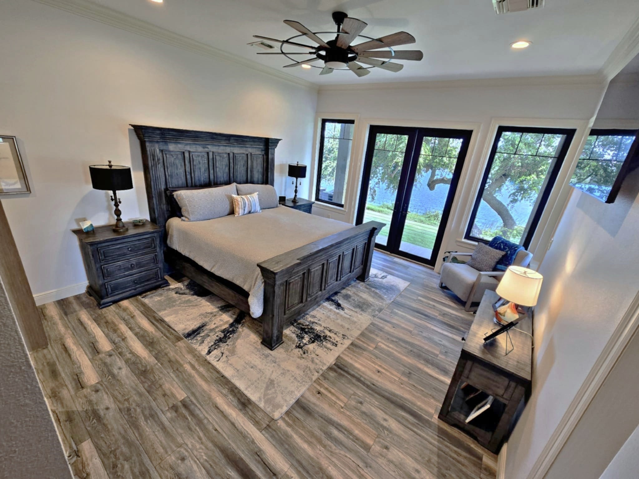 7165 Backridge Road Sabine Pass, TX 77655 - Photo 14 of 49 a bed sitting in a bedroom next to a window