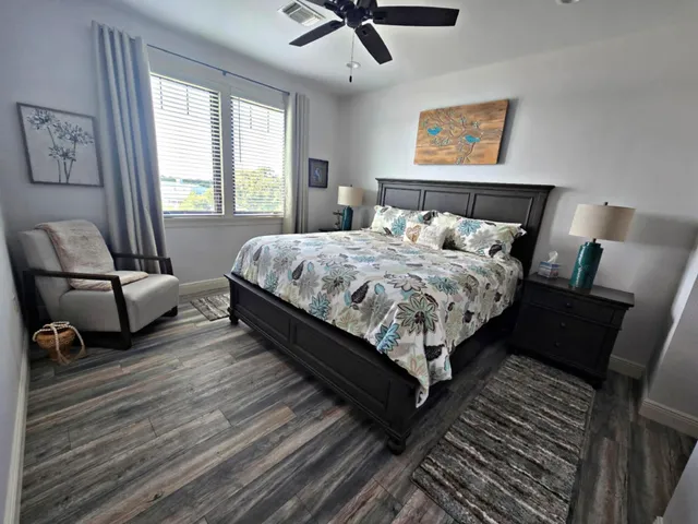 a bed sitting in a bedroom next to a window