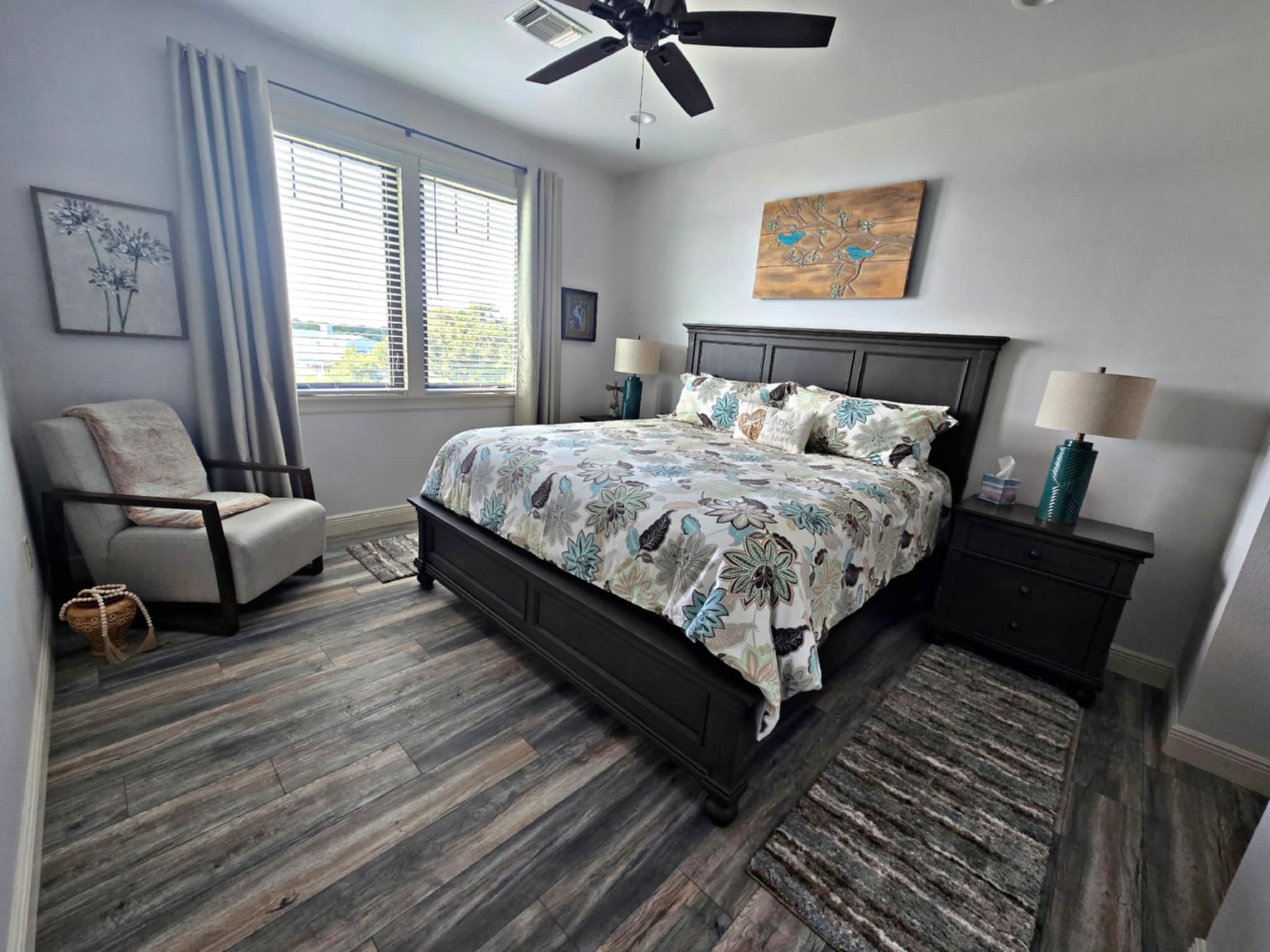 7165 Backridge Road Sabine Pass, TX 77655 - Photo 21 of 49 a bed sitting in a bedroom next to a window