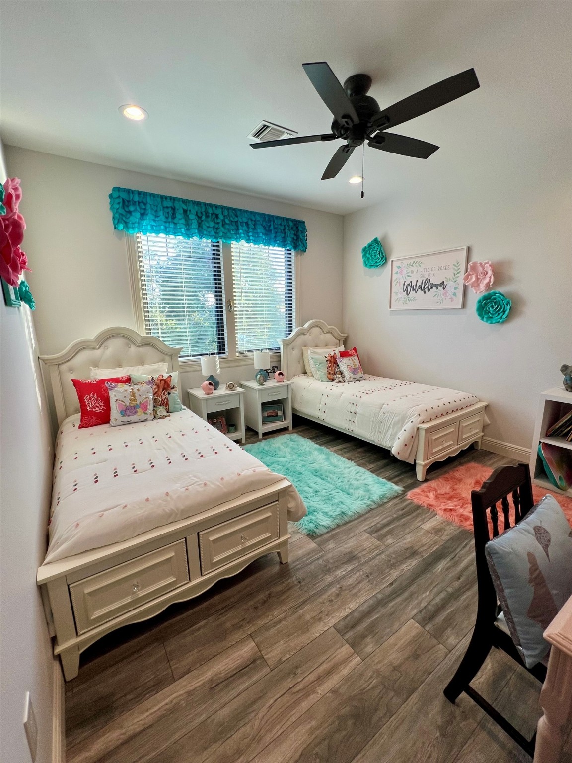 7165 Backridge Road Sabine Pass, TX 77655 - Photo 25 of 49 a bedroom with a bed and a chandelier