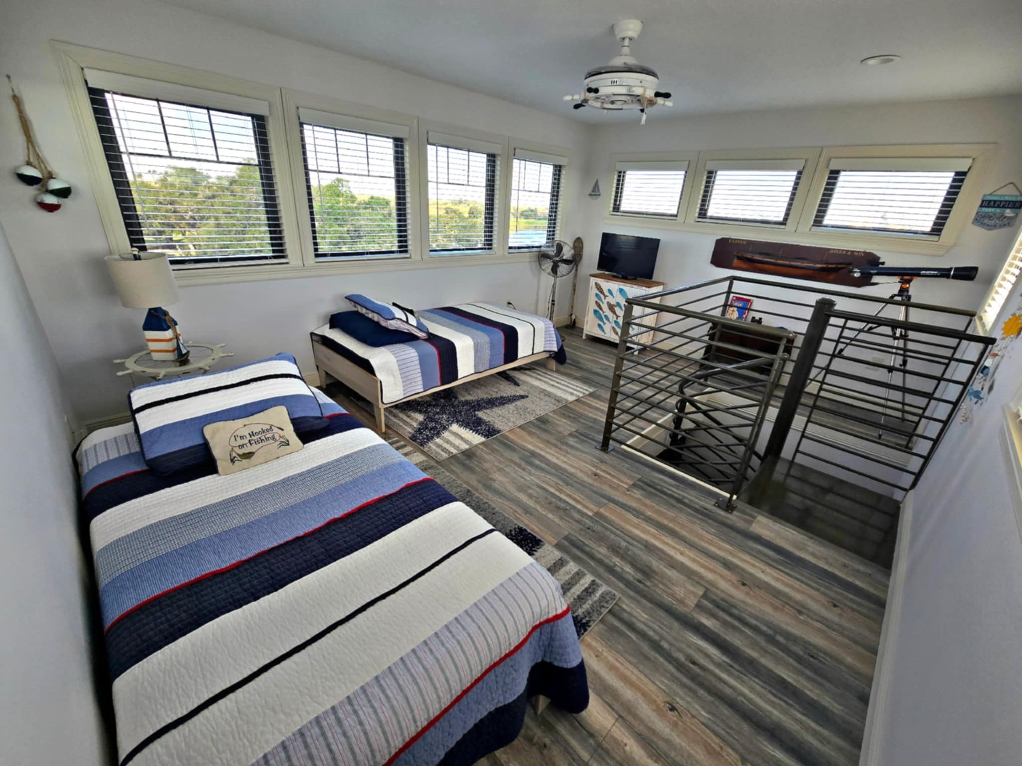 7165 Backridge Road Sabine Pass, TX 77655 - Photo 27 of 49 a bedroom with a bed next to a window with a dresser