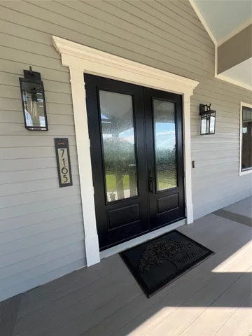 a view of a hallway view with staircase
