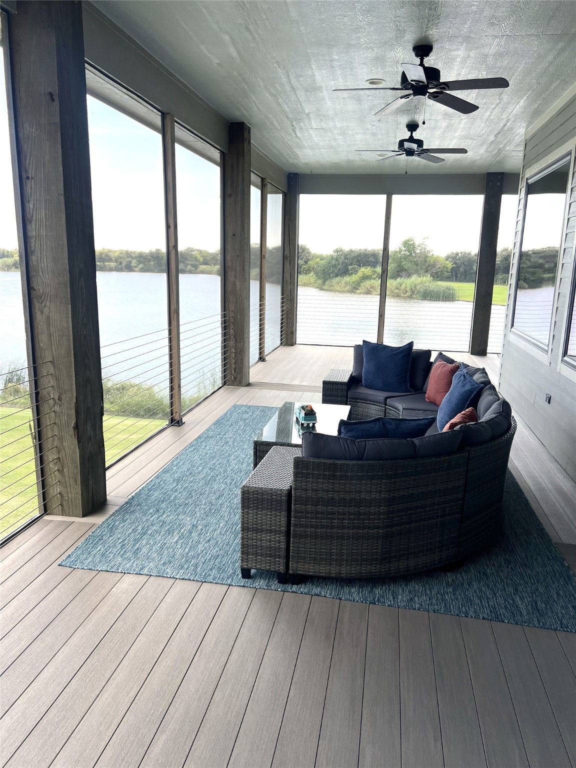 7165 Backridge Road Sabine Pass, TX 77655 - Photo 31 of 49 a living room with furniture and large windows