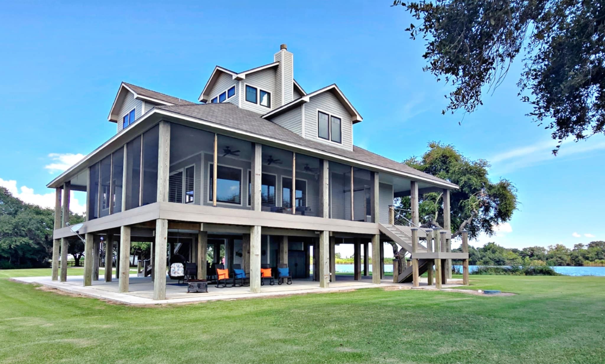 7165 Backridge Road Sabine Pass, TX 77655 - Photo 34 of 49 a front view of a house with swimming pool and sitting area