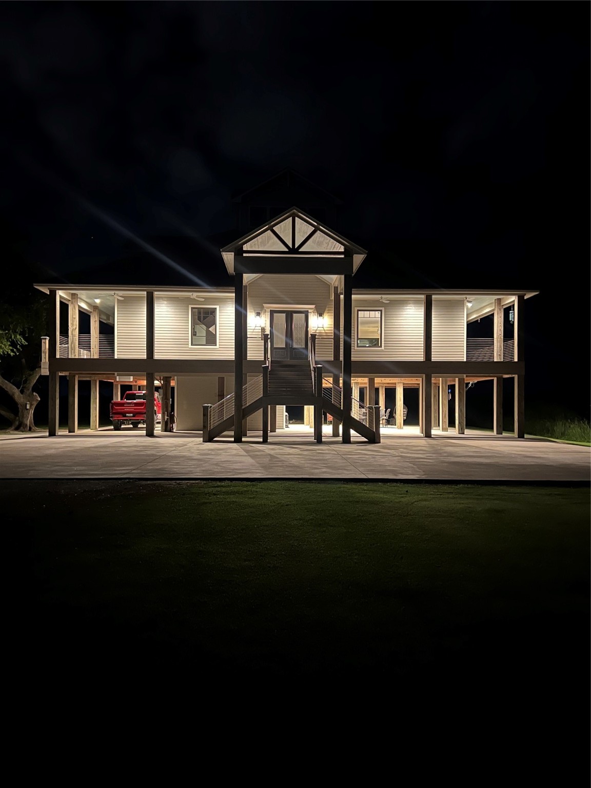 7165 Backridge Road Sabine Pass, TX 77655 - Photo 37 of 49 a front view of a house with a garden