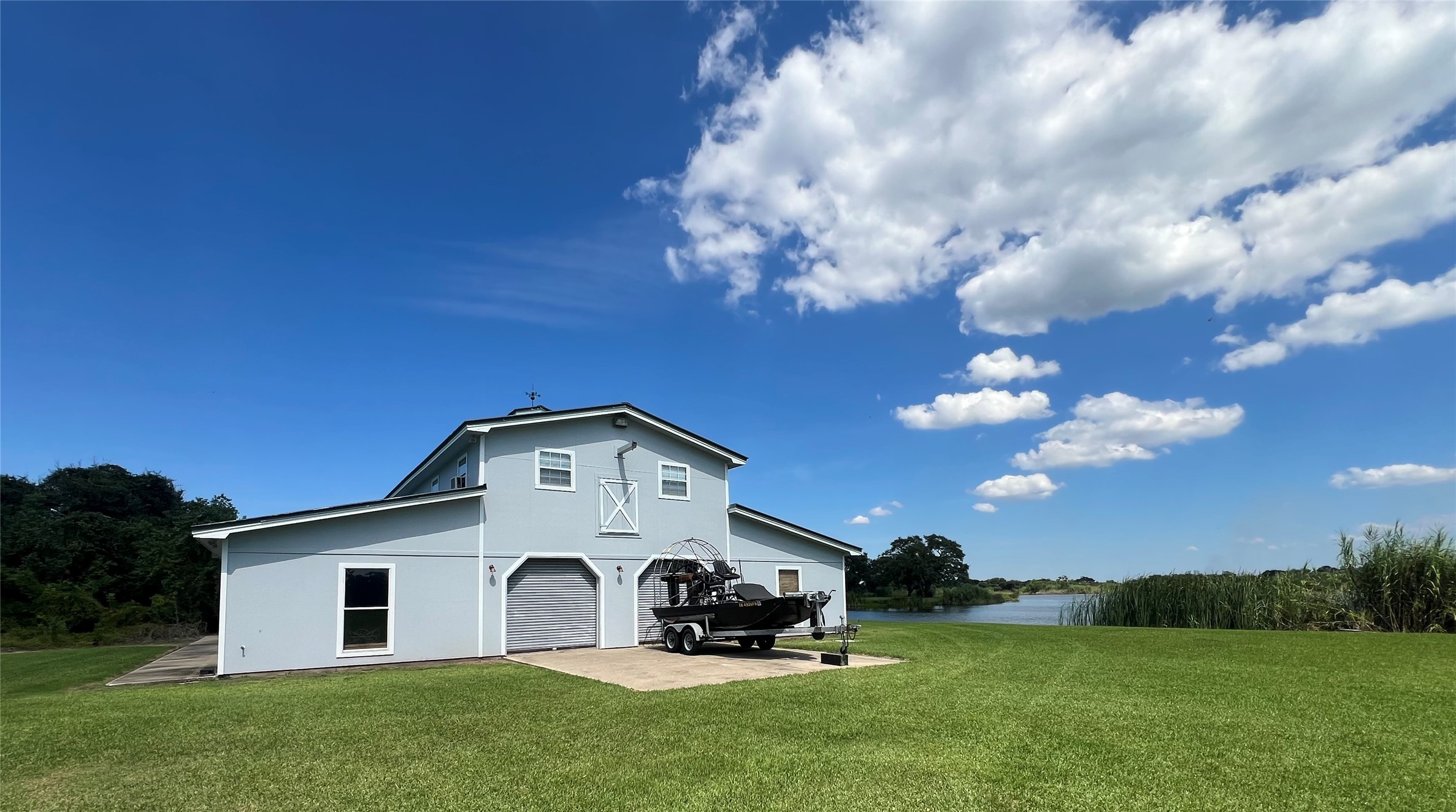 7165 Backridge Road Sabine Pass, TX 77655 - Photo 38 of 49 a front view of a house with garden