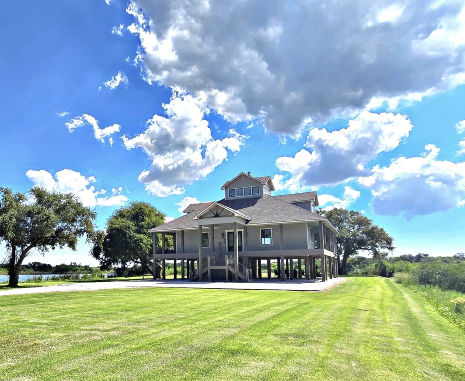 7165 Backridge Road Sabine Pass, TX 77655 - Photo 4 of 49 a front view of a house with swimming pool having outdoor seating