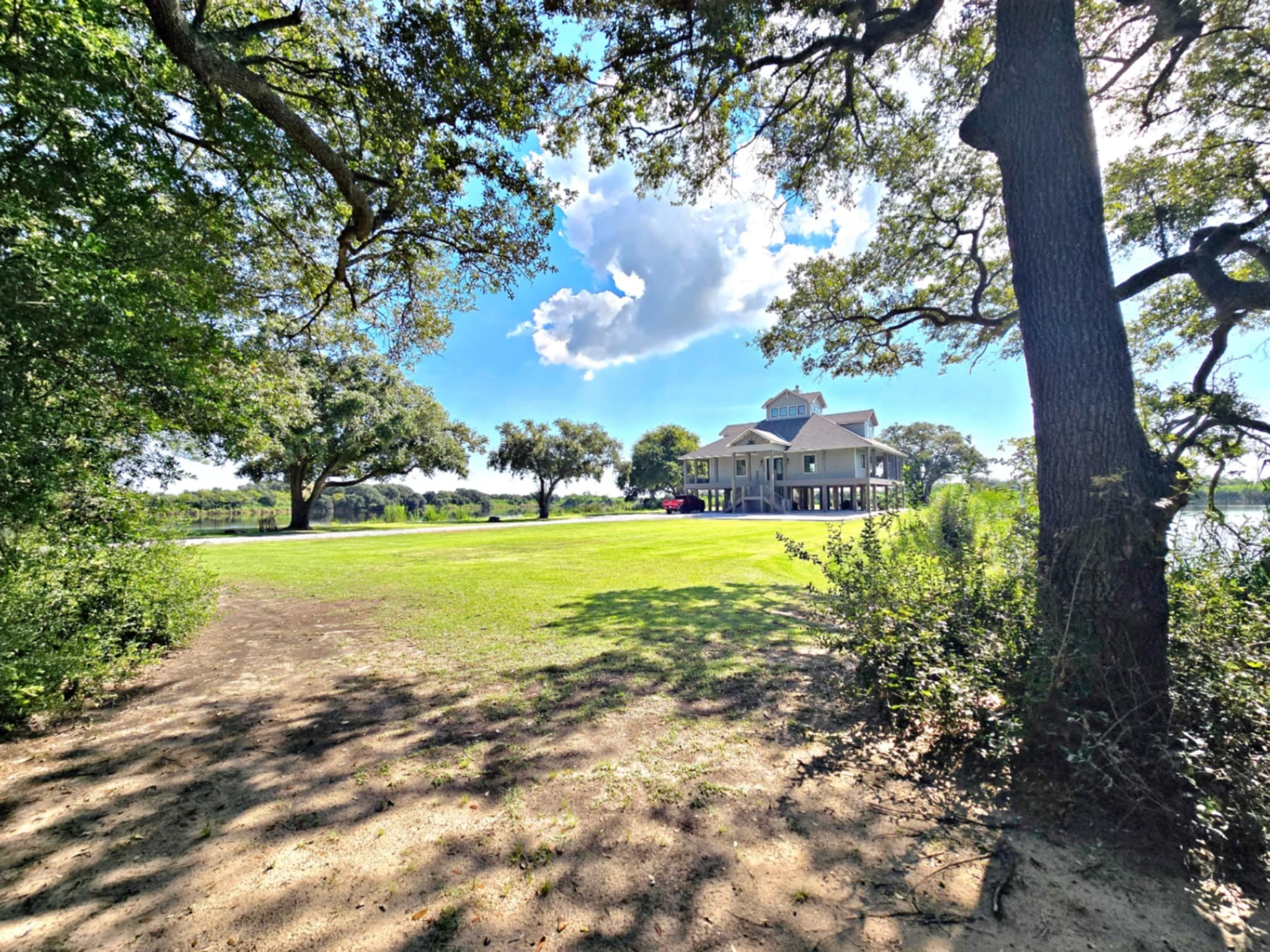 7165 Backridge Road Sabine Pass, TX 77655 - Photo 49 of 49 a view of a fountain is middle in the garden