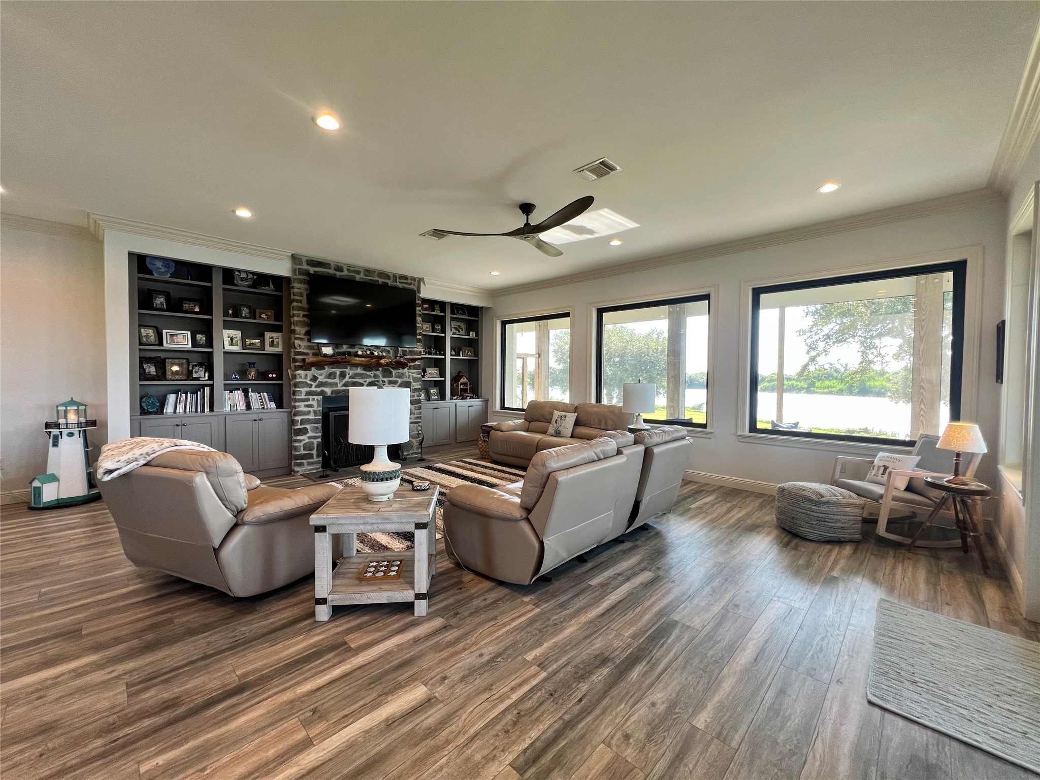 7165 Backridge Road Sabine Pass, TX 77655 - Photo 6 of 49 a living room with furniture and a wooden floor