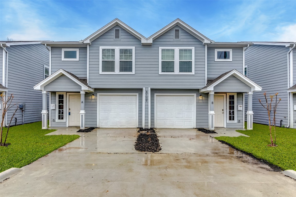 8113 Corinth Street, Unit B Houston, TX 77051 - Photo 2 of 15 a front view of a house with a yard and garage