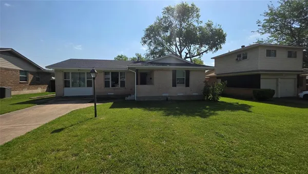 a house view with a garden space