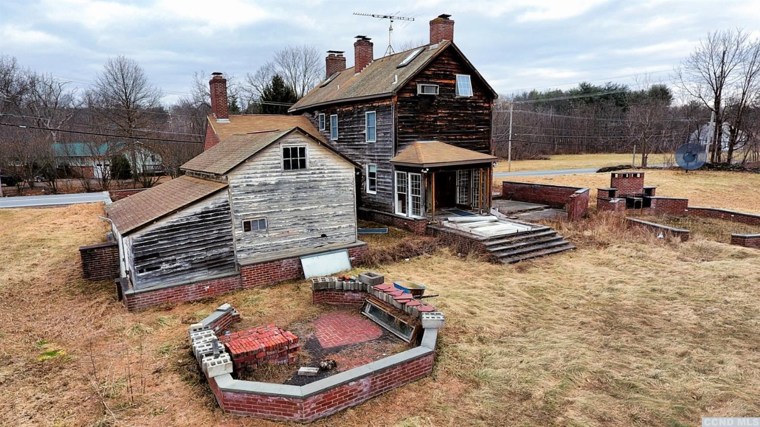 189 Main Street Cairo, NY 12413 - Photo 10 of 57 a front view of a house with swimming pool and sitting area
