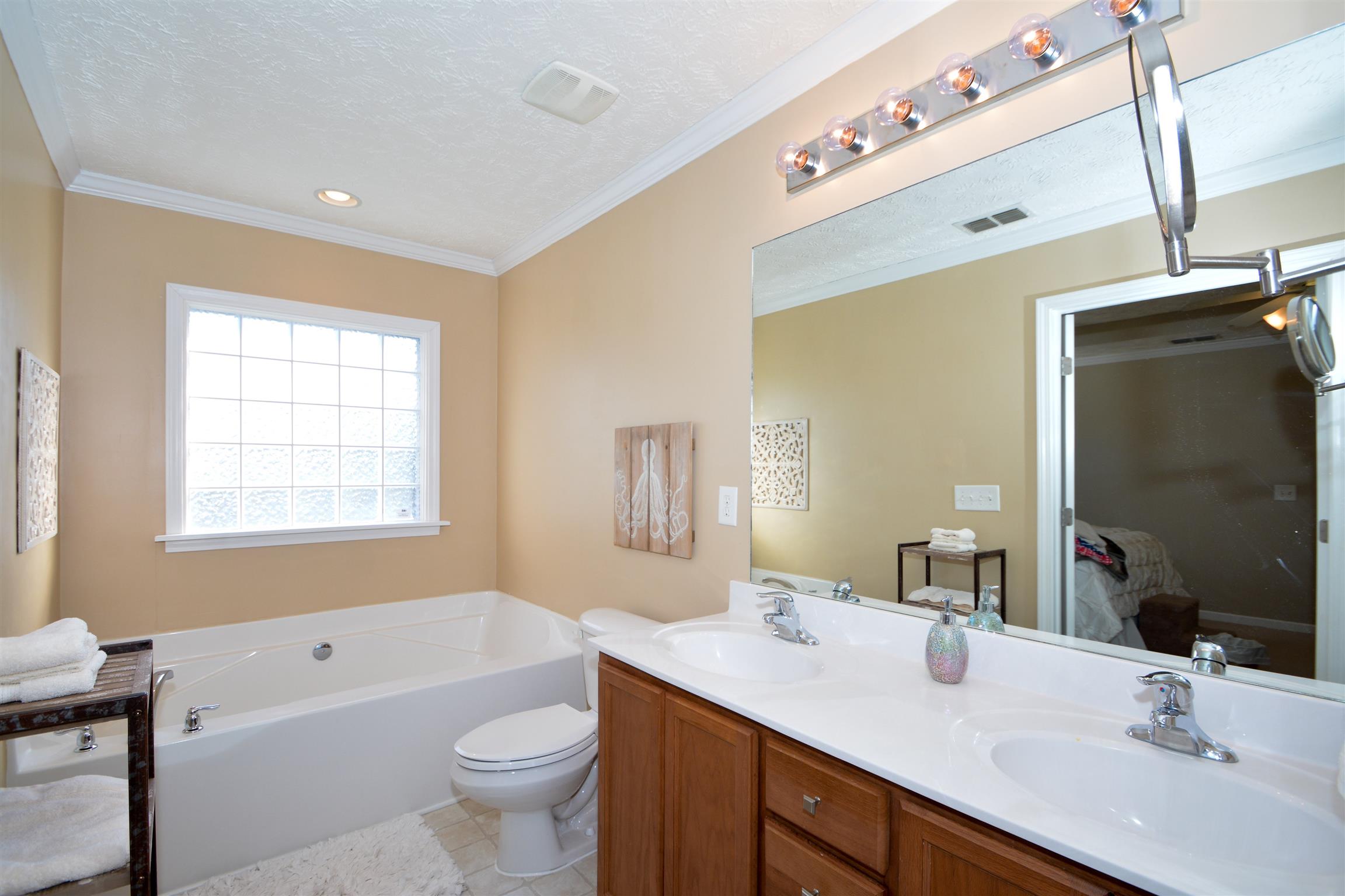 2026 Red Jacket Trace Spring Hill, TN 37174 - Photo 15 of 28 Full bath in the master suite. Enjoy the luxury of a separate tub/shower, and his & hers sinks.