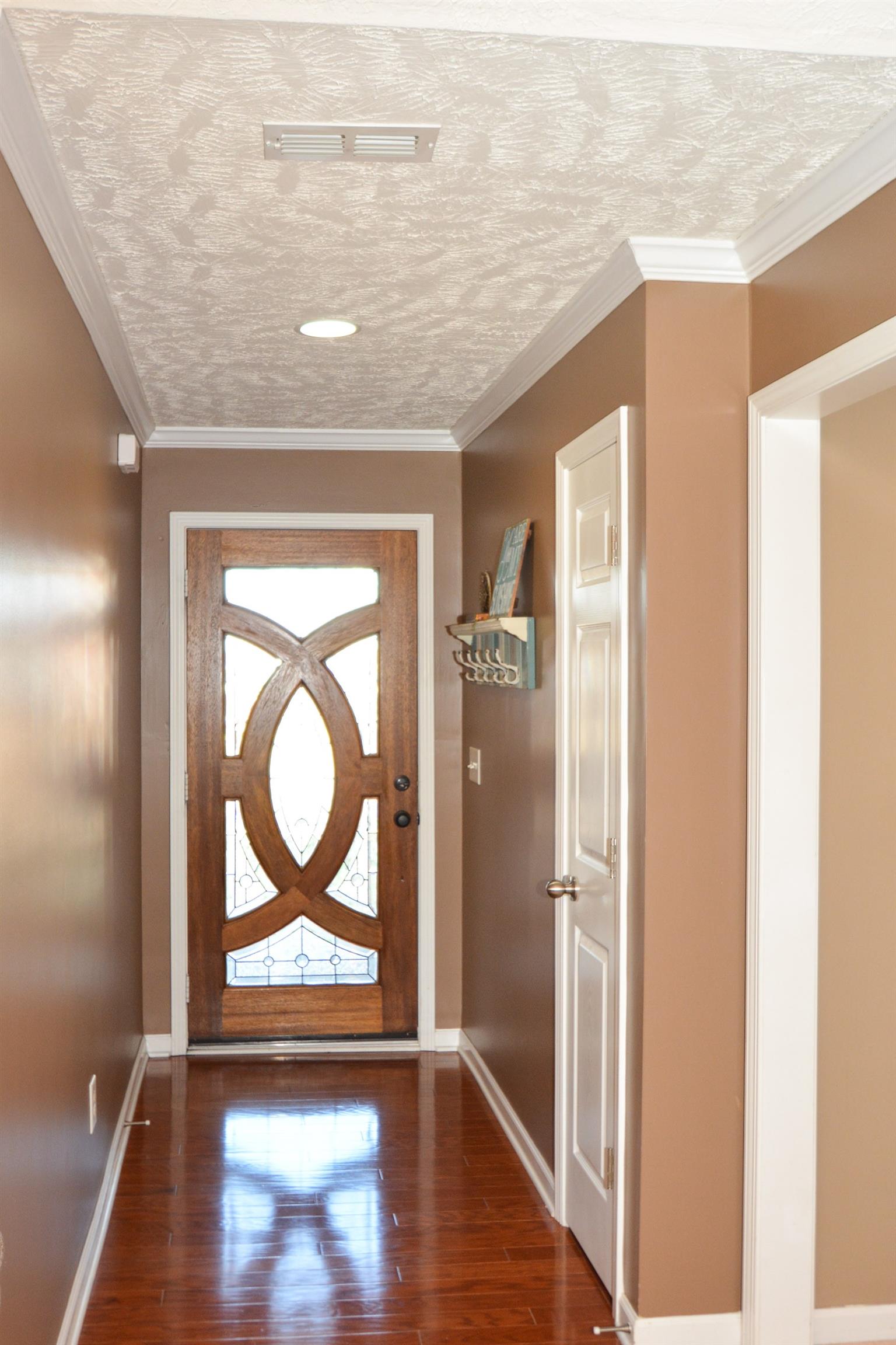 2026 Red Jacket Trace Spring Hill, TN 37174 - Photo 4 of 28 Beautiful wood door with glass inlay makes for a sophisticated and welcoming entry.