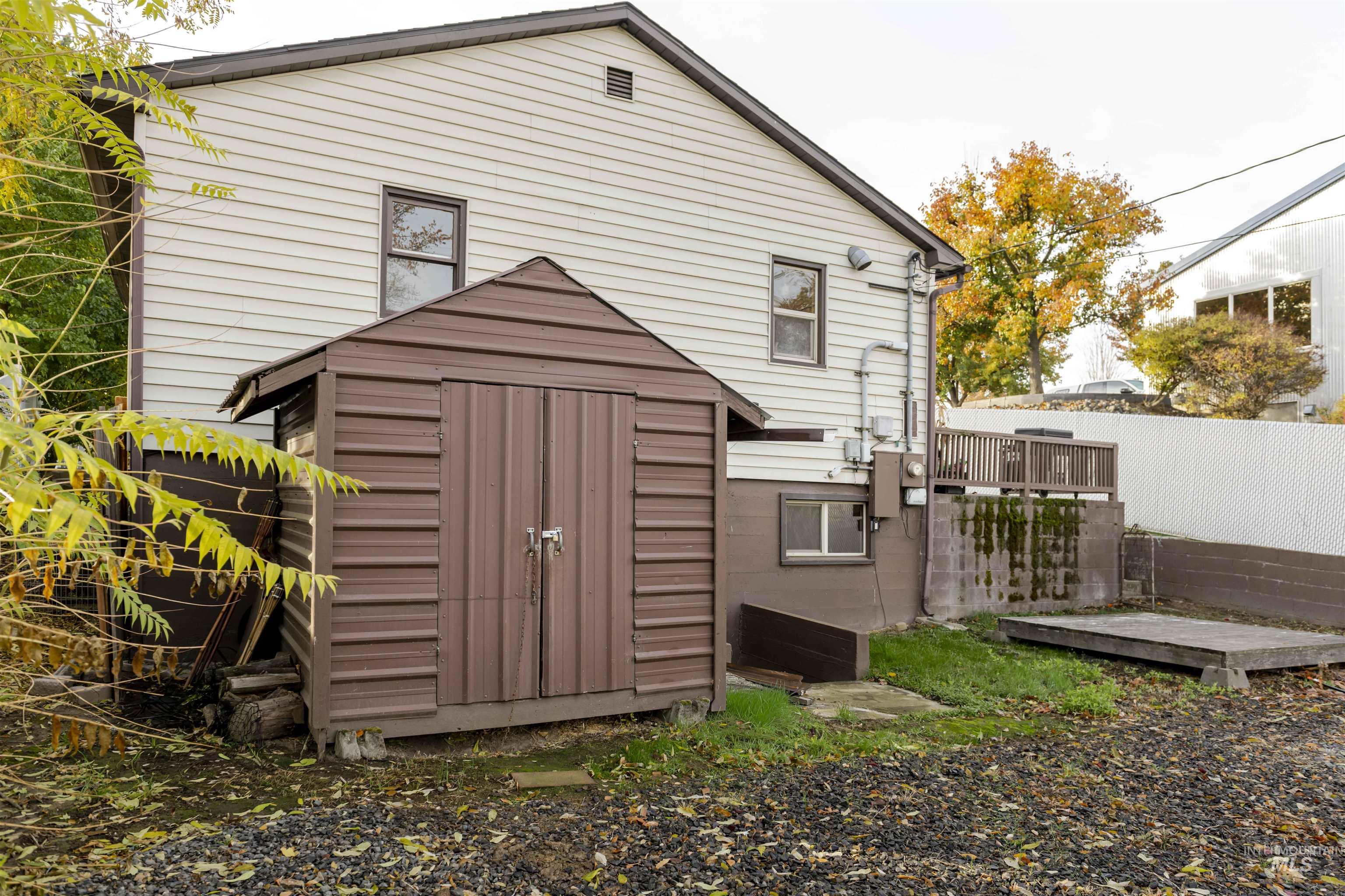 2127 12th Avenue Lewiston, ID 83501 - Photo 19 of 27 Back of house with a shed and a wooden deck