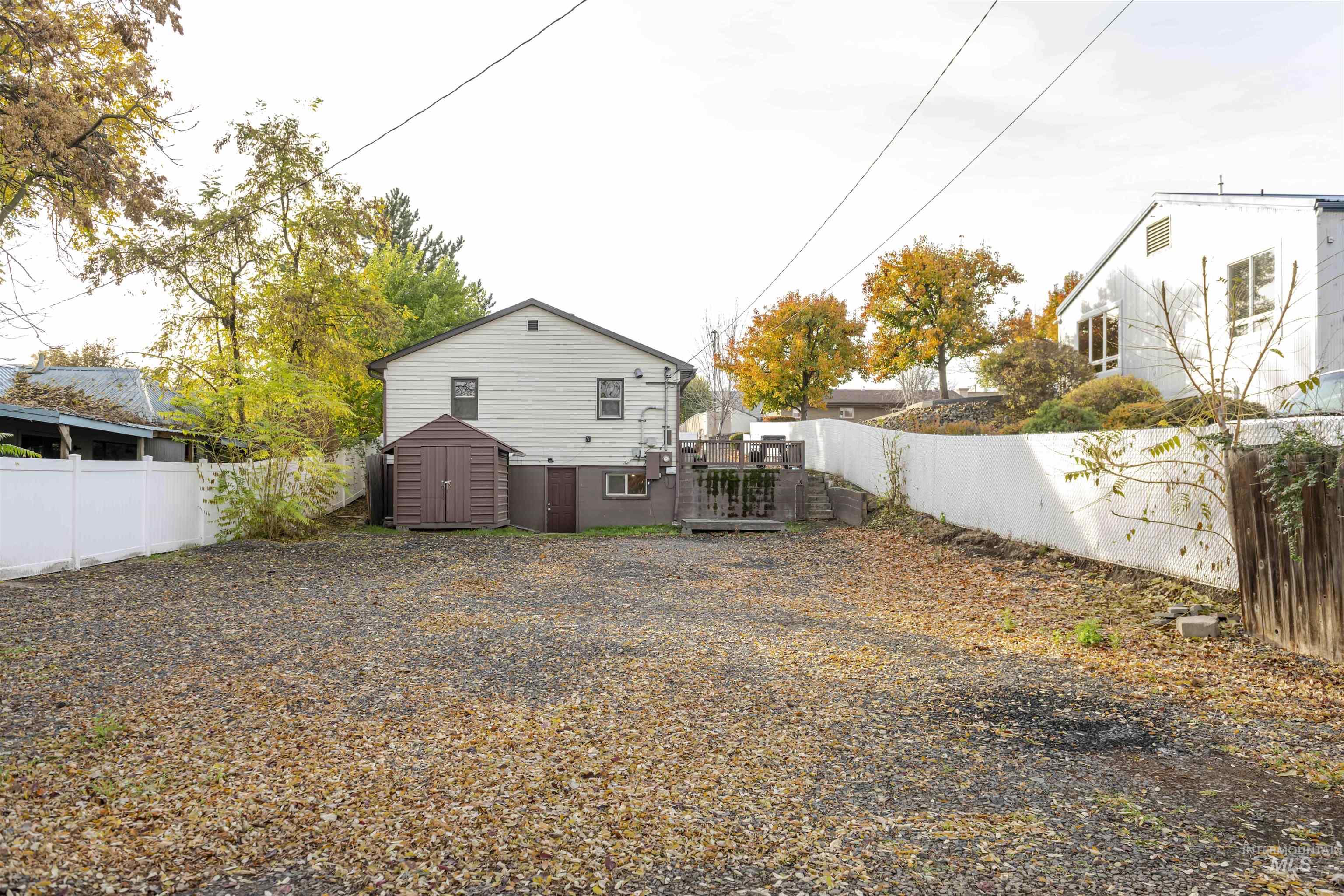 2127 12th Avenue Lewiston, ID 83501 - Photo 24 of 27 Back of property featuring a fenced backyard and a shed