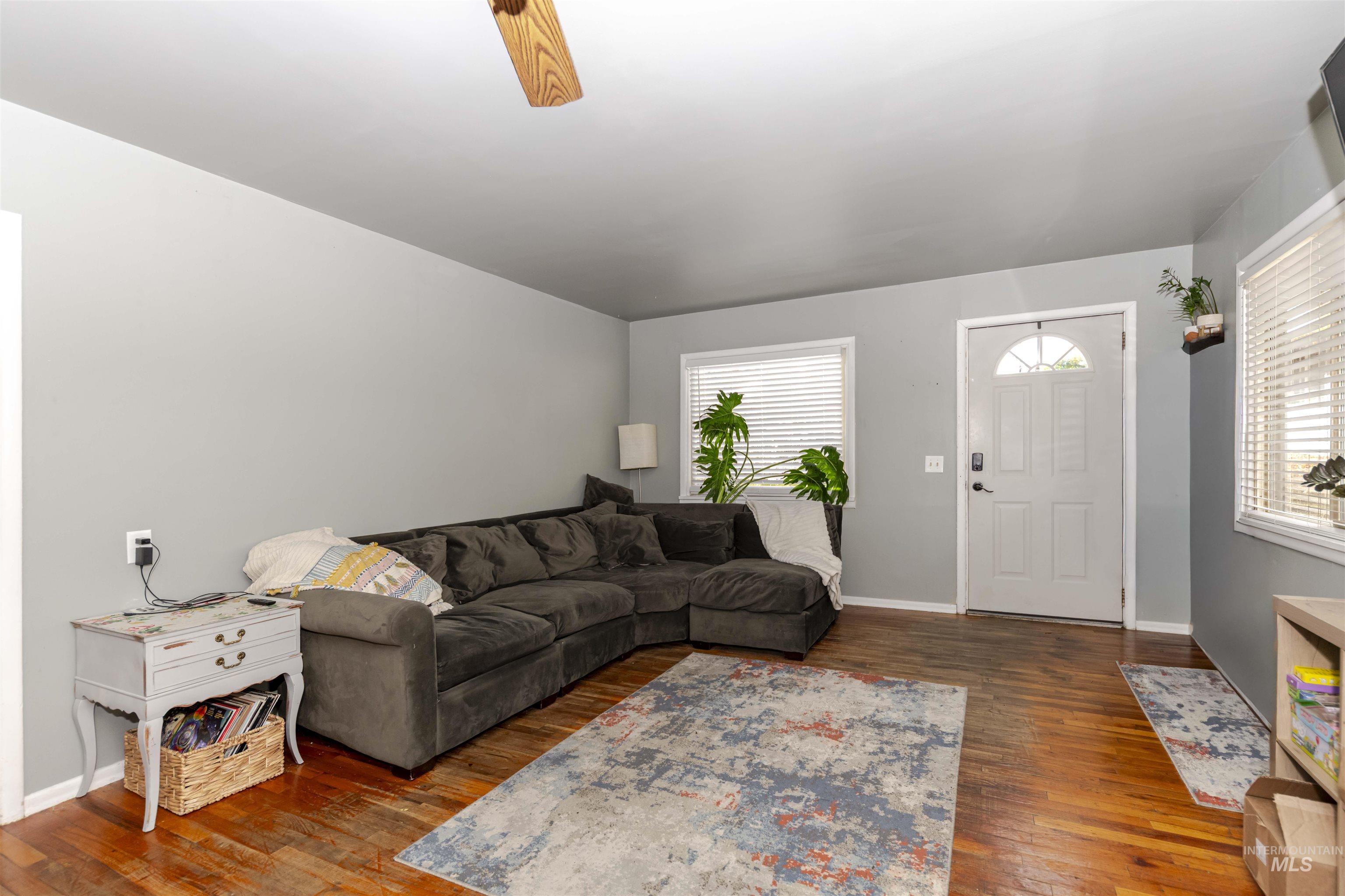 2127 12th Avenue Lewiston, ID 83501 - Photo 4 of 27 Living area featuring dark wood-type flooring