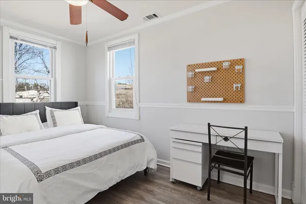 a bedroom with a bed and a dresser