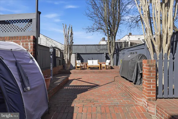 a view of a backyard with sitting area