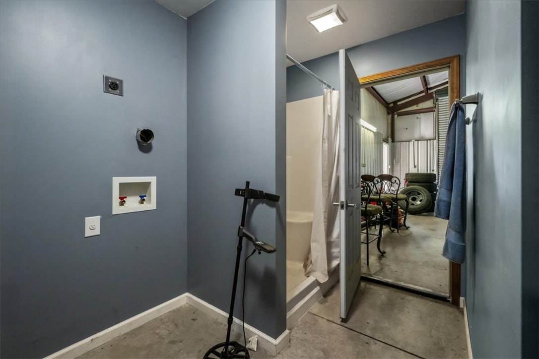 212 Winding Lane Seneca, SC 29672 - Photo 42 of 47 This functional space offers practicality with laundry hookups and a convenient shower area.