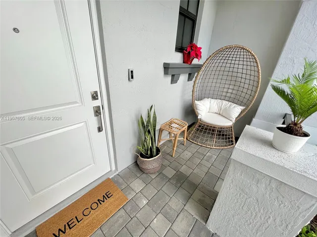 a living room with furniture and a window