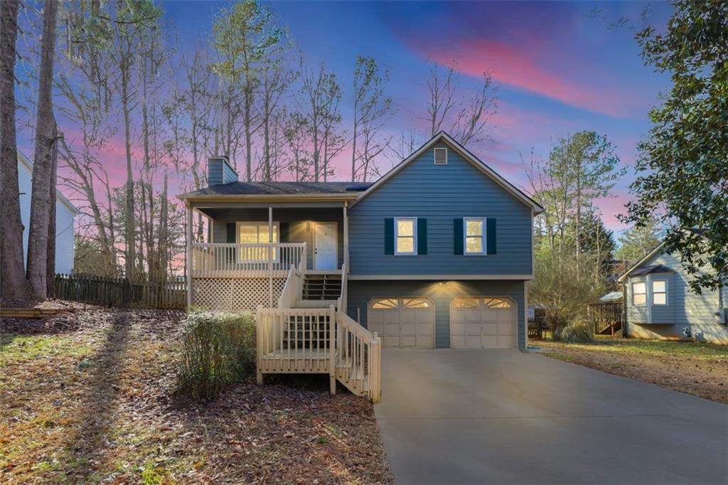 523 Villa Rosa Road Temple, GA 30179 - Photo 1 of 1 a front view of a house with garden