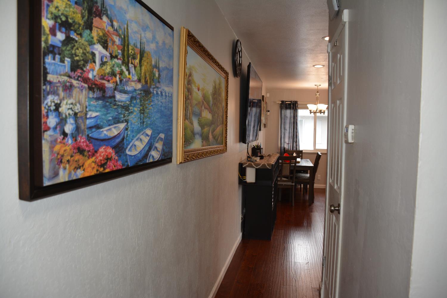 5630 Allen Avenue, Unit 4 San Jose, CA 95123 - Photo 17 of 23 a view of a hallway with wooden floor and furniture