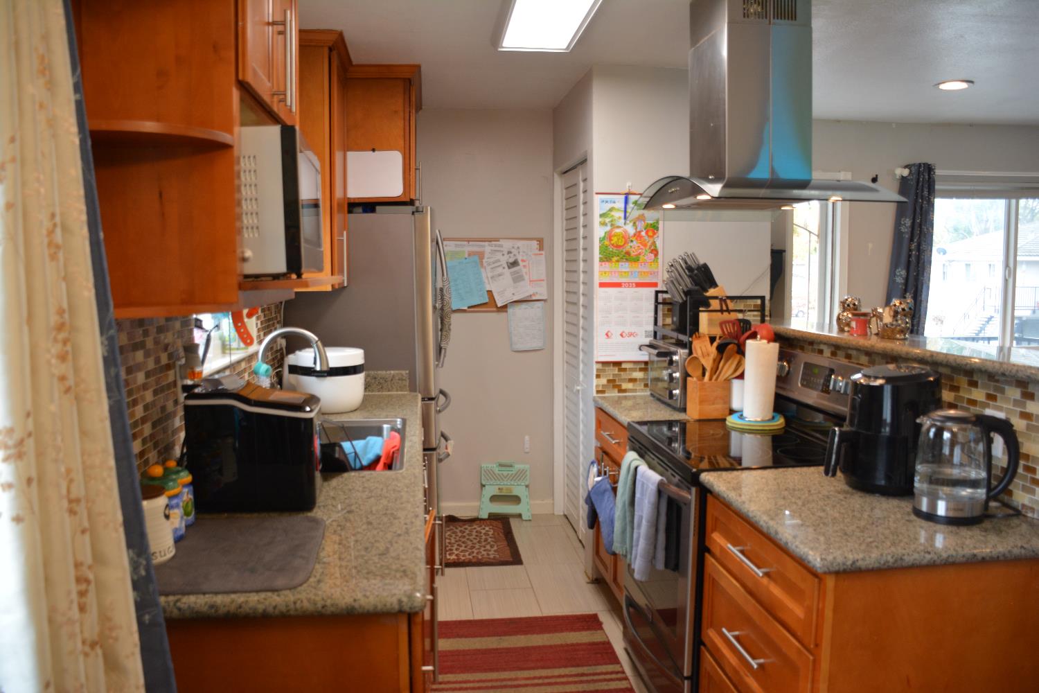 5630 Allen Avenue, Unit 4 San Jose, CA 95123 - Photo 4 of 23 a kitchen with a refrigerator and a stove
