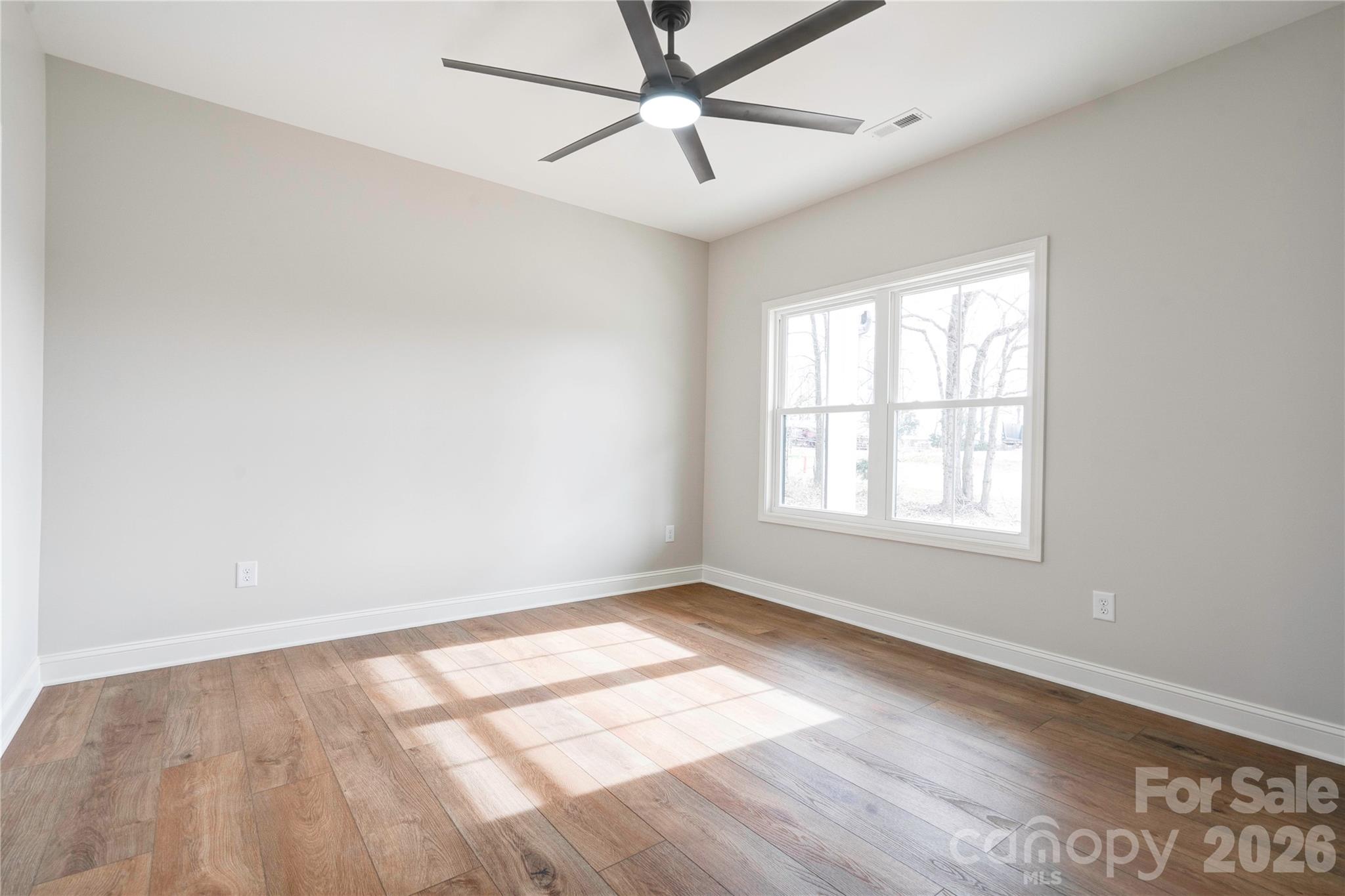 2343 Cherryville Road Cherryville, NC 28021 - Photo 17 of 32 wooden floor in an empty room with a window