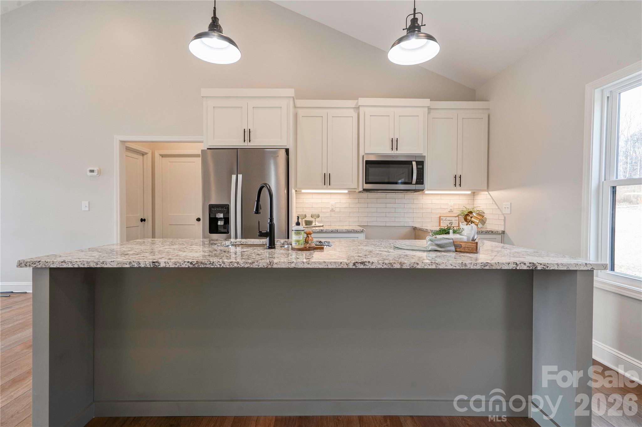 2343 Cherryville Road Cherryville, NC 28021 - Photo 10 of 32 a kitchen with stainless steel appliances granite countertop a sink a stove a refrigerator a center island and cabinets