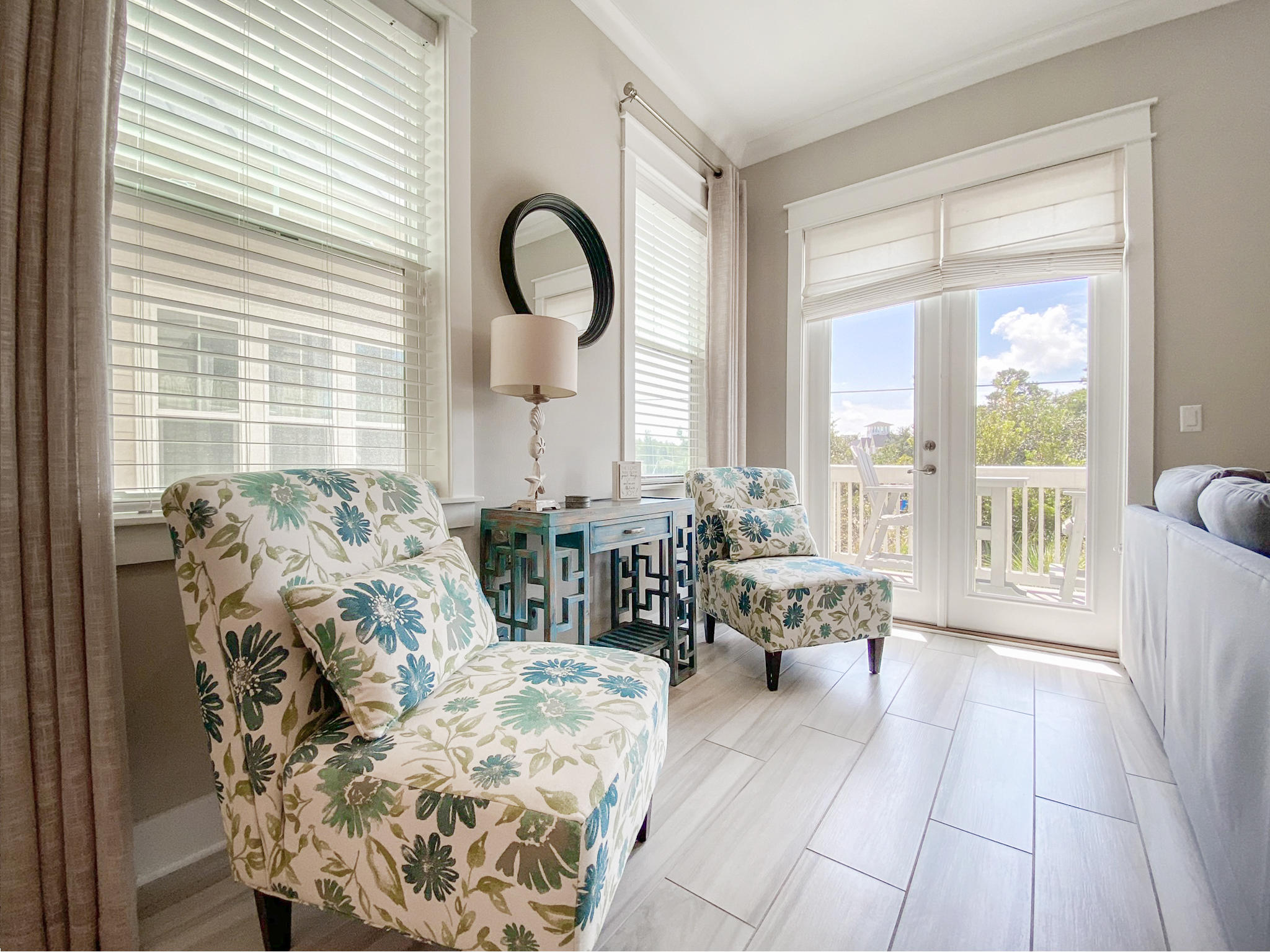 79 Milestone Dr Inlet Beach, Unit A Inlet Beach, FL 32461 - Photo 11 of 34 a living room with furniture and floor to ceiling windows