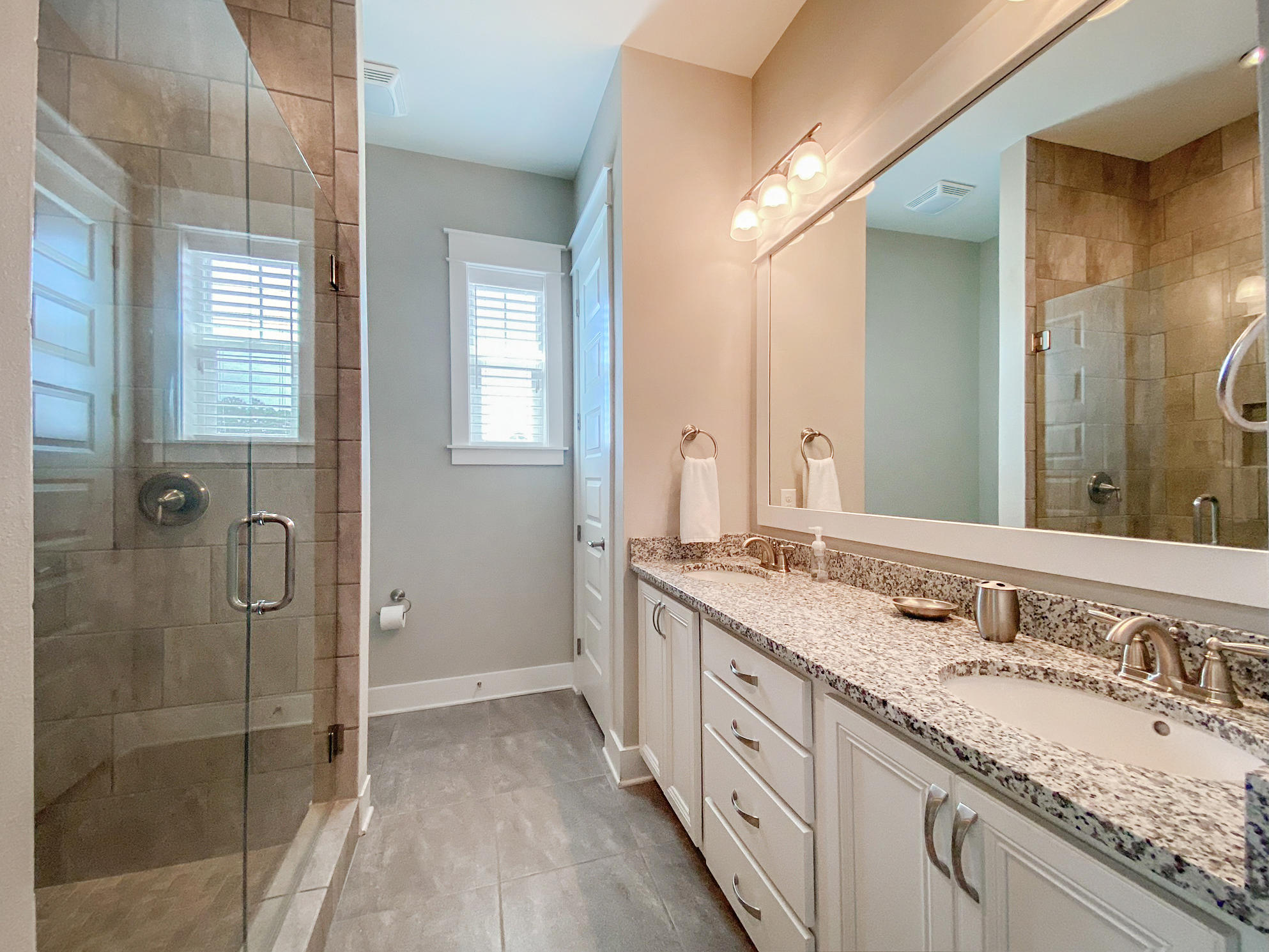79 Milestone Dr Inlet Beach, Unit A Inlet Beach, FL 32461 - Photo 15 of 34 a spacious bathroom with a granite countertop sink mirror and double