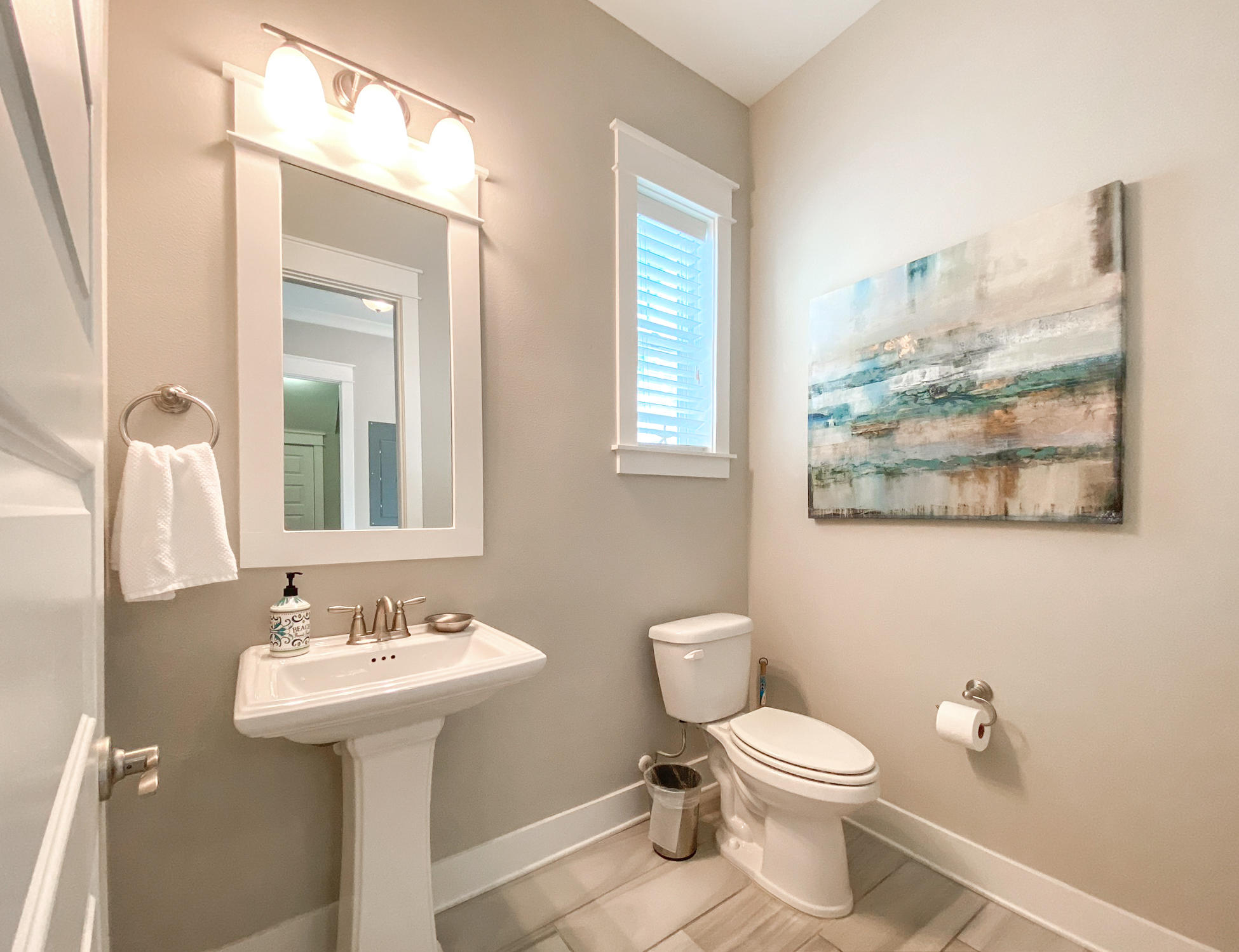 79 Milestone Dr Inlet Beach, Unit A Inlet Beach, FL 32461 - Photo 21 of 34 a bathroom with a toilet sink and mirror