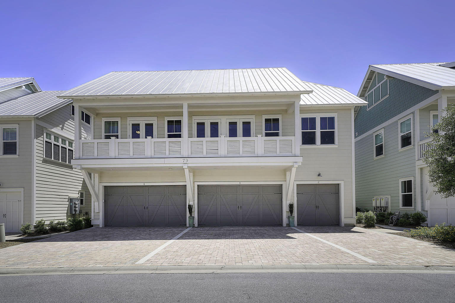 79 Milestone Dr Inlet Beach, Unit A Inlet Beach, FL 32461 - Photo 25 of 34 a front view of a house with a garage