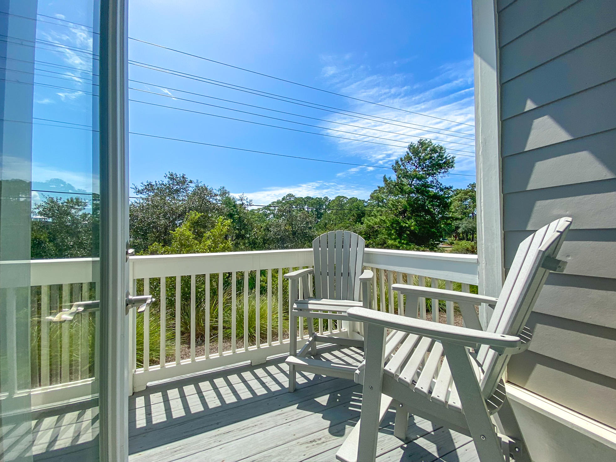 79 Milestone Dr Inlet Beach, Unit A Inlet Beach, FL 32461 - Photo 7 of 34 a view of balcony with wooden floor and outdoor seating
