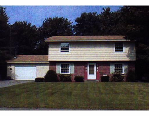 27 Algonquin Road Chelmsford, MA 01824 - Photo 1 of 1 a front view of a house with a garden