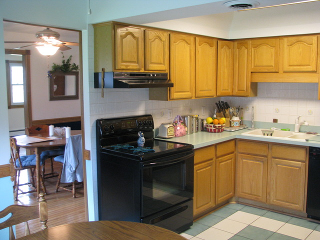 838 Carlisle Road Batavia, IL 60510 - Photo 8 of 13 a kitchen with a sink stove and cabinets
